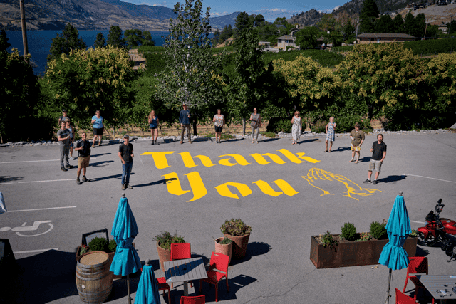 Thank you is written in large script in the parking lot of Blasted Church Vineyards